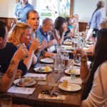 Guests speaking with Co-Founder and Master Distiller Brent Ryan of Newport Storm (third from left) during the Farm-to-Table dinner.