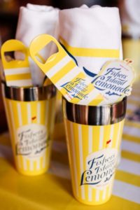 Fishers Island Lemonade cocktail mixers and bottle openers on display.