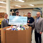 Twin River and its employees donated $1,000 and 1,709 pounds of food to the RI Community Food Bank on June 24th to kick off the agency’s annual summer food drive. Andy Moffitt, First Gentleman of Rhode Island; Adam "Opie" Oppenheimer, Bartender, Twin River Casino; Frank Martucci, General Manager, Beverage Operations, Twin River Casino; and Andrew Schiff, Chief Executive Officer, RI Community Food Bank. In total, Twin River’s donation will provide 6,237 meals to those in need.