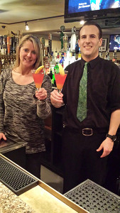 Bartenders Stephanie Harris and Nathaniel Crowley holding Spring Forward Cocktail  