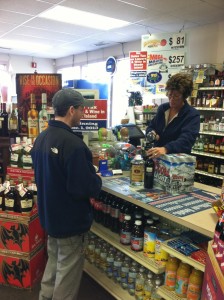 A customer checks out at Malik's Liquors in Warren.