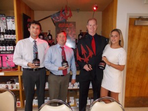 Gary Dritschler, Market Manager at Campari America, holds a pitchfork. Shown with him are Sales Managers Bill Saroka, Ben Mayey and Christine Peterson, all of Hartley & Parker. 