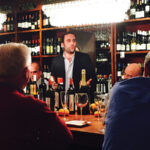 Baracchi addresses guests at Madison Wine Shop