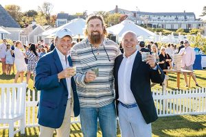 Owners Bill Dessel, Matt Light and Tom McGowan at a summer event at Chatham Bars Inn.