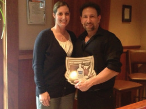 Jackie Blau presents Rob Martini his official plaque for winning Connecticut’s Absolut Bloody Mary Competition held in 2013