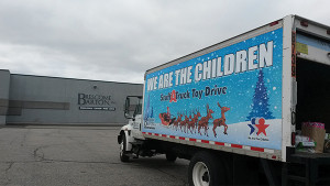 Brescome Barton and We Are the Children held a “Stuff a Truck” Toy Drive