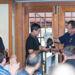 Marine Corps-Law Enforcement Foundation President Ed Boran (left) and Chairman Jim Kallstrom (right) presented Brescome Barton CEO and President Gene Sepe (center) with a “Tears From a Grateful Heart” sculpture, which recognizes the “deep appreciation for leadership, and tremendous support and dedication” over the past five years by annually hosting the charitable event.