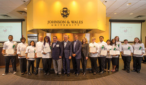 Chayil A. Johnson '17; Kiara Patrice Whitehead '17; Ricca Chelsi Dadulla Palero ’18; Matthew David Zoe '17; Mia Kianni Williams '17; Chef Emeril Lagasse '78; '90 Hon.; JWU Chancellor John J. Bowen ’77; Tournament Chairman Stephen J. Caldeira ’07 Hon., JWU President Mim L. Runey, LPD; Ashlee Redger '17; Keonna C. Yearwood '18; Yessica Marleny Perez '17, Sephora Dubreuze '17; Caroline Snyder '17; Genoa Donaldson '17 and Emily Rondeau '17.