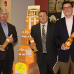 Prestige Wine Group’s Vice President Chuck Andreae pictured with CDI’s Business Manager Steve Drew and Ryan Sullivan, Regional Manager of Prestige Wine & Spirits presenting Kinky Gold. Kinky Gold, the newest flavor in the line that includes Kinky Blue and Kinky Pink Liqueur, is a fusion of premium vodka with a tropical blend of peach flavors.