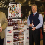 Tim Clarke, General Manager of Polly & Joan Cordial Co. and Steve Baye, Vice President of Business Management and Marketing, CDI, with Polly & Joan’s Cordials. The new line of whole-cluster fresh fruit and clear-filtered handcrafted cordials from Wallingford, Conn. is available in two flavors: P&J Cold-Soaked Berries and P&J Cold-Soaked Peaches.