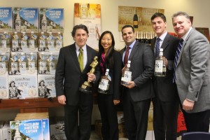 Steve Lentz, General Sales Manager, Brescome Barton; Kim Maciejewski, Diageo Marketing Manager, CT; Dominic Italiano, Diageo Distributor Manager, CT; Steve Giles, Diageo Sales Director, CT; and Dan Miller, Dedicated Trade Development Manager for Diageo and Moët Hennessy, Brescome Barton. Lentz is holding a Calvin award, given to Brescome Barton in 1984 by the Calvert division of Seagrams, for first place in their division in selling Captain Morgan Spiced Rum.