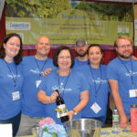 Linda Auger (center), Owner of Taylor Brooke Vineyard, surrounded by representatives from Taylor Brooke. 