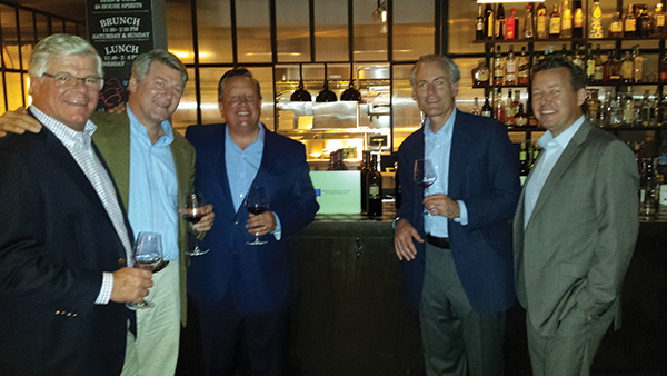 Teddy Bobroske, Senior Vice President, Webster Bank (third from left) with S. Garret Stonehouse, Owner, Aventine Hill Importers (second from right) surrounded by a group of guests from the wine tasting.