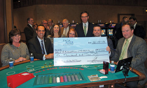 From left to right: Valley Breeze Sales Director Karen Buckley, $7,500 for the Lime Rock Baptist Church Community Garden and Food Pantry in Lincoln; RI Sec. of State A. Ralph Mollis, $3,500 for the MS Dream Center; State Rep. Lisa Tomasso, $2,500 for the Coventry Community Food Bank; Dale Venturini, $5,000 for the R.I. Hospitality Education Foundation; State Rep. Scott Slater, $10,000 for the Assumption of the Blessed Virgin Mary Church Food Pantry; and RI State Sen. Mike McCaffrey, $1,500 for the RI Academic Decathlon. At rear center is John Taylor, Twin River's Chairman of the Board.