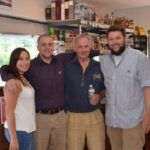 Staff of Vino et all: Serena Pagano, Cashier; Ryan Hackett, Store Manager; Ty Nicholson, Wine and Spirit Manager; Ryan Perodeau, Beer Consultant.