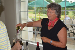 Donna Hutchinson is shown pouring at a 2015 Winebow of Connecticut tasting.