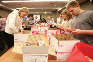 Volunteers and employees were able to create care packages to send to deployed troops with the help from Packages From Home.