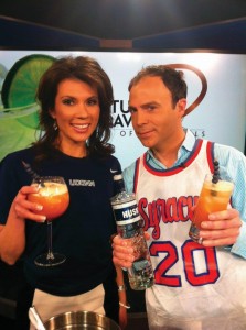 As part of its local debut, Erika Arias and Jimmy Altman from Fox News CT “Morning Extra” pose with the “There’s a New Dog in Town Husky Hoop Heaven,” a cocktail created with Husky Vodka, newly distributed by WINAM Wines. The cocktail was featured on the morning show news broadcast April 5, 2013. The drink is made to look like a basketball and there are eight blueberries as a garnish; seven represent the UCONN Husky Women’s seven titles and the eight is for “crushing the competition and win their 8th title.”