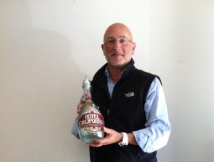 Jonathan Goldstein from Sipping Spirits, LLC holding his award winning Hotel California Tequila