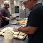 Anibal “Willy” Figueroa, Night Crew with Tony Lodato, Check-In Driver, preparing sandwiches to serve to the community.