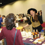 Jessyloo Rodrigues of Caledonia Spirits with Barr Hill Spirits, speaking with guests.