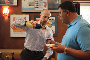 Nick Neves, Trade Development Manager, Worldwide Wines pouring for Vipul Gandhi, Stratford Spirit Shop.