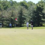 A foursome of golfers.