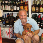 Owner M. Scott Lyons with store dog, Stella.