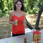 Lisa Bufe, volunteer, pouring Cider Creek Hard Cider samples.