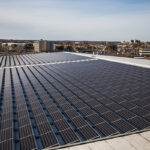 The solar panels are divided across two sections on the roof of CDI's 140,000 square foot facility in Stratford. Photo by Joe Palisi.