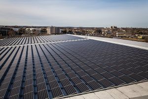 The solar panels are divided across two sections on the roof of CDI's 140,000 square foot facility in Stratford. Photo by Joe Palisi.