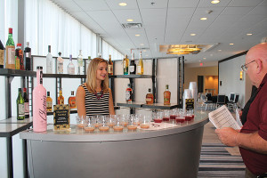 Tricia Galinski of Slocum & Sons showcasing Chopin Potato Vodka, Dorda Double Chocolate Liqueur, Karma Tequila Silver, LeJay Crème de Cassis and Hammer & Sickle Ginger Beer.