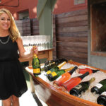 Donna Taylor, Beverage Professional, Vine Ventures with Drappier Champagne beside the sparkling wine bar.