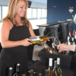 Donna Taylor of Vine Ventures pouring selections from Sterling Vineyards.