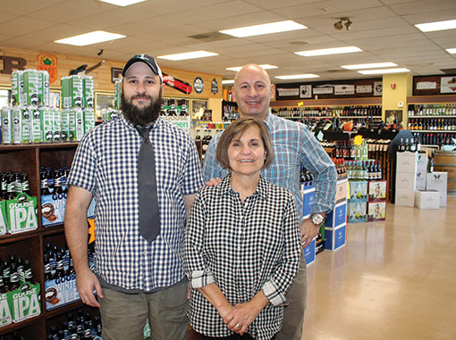 Christian Iezzi beside Terri Audet and Jim Iezzi.