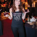 Kellie Fonnemann of Hot Rod Café in New London holding her prepared Bonnie Rose cocktail.