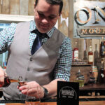 Jordan Szczygiel, Tasting Room, Onyx Spirits Company, poured samples for guests during the event.