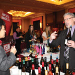 Steve Fanelli, Key Account Manager, Hartley & Parker speaking with Irene Tan, Owner, Brooklyn Wine & Spirits.