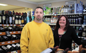 Owner Anthony Lewis and store employee Jess Tilley.