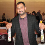 Sunny Rajvansh, Sales Representative, Slocum & Sons, pouring fruit brandy and eau de vie selections made by Westford Hill Distillers in Ashford.