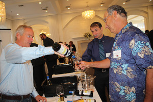 James Teegan, Northeast Sales Manager, Rombauer Vineyards pouring samples for Ken Chicoria and Clark Nicholas of Hopkinton Liquor Depot.