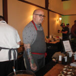 Chef Tyler Anderson of Millwrights in Simsbury speaking with guests during the Taste of Farmington.