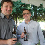 Brescome Barton Sales Representatives Matt Smulski and Leigh Harper pouring samples of Steadfast Beer.