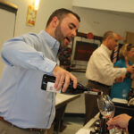 Mike Tobin, Manager, Worldwide Wines pouring samples.