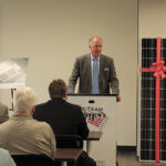 John Parke, President, CDI, welcoming guests to the ribbon cutting.