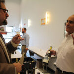 Howard Asadow, Worldwide Wines’ Regional Manager, with Richard Aries of Charles Fine Wines in Glastonbury, pouring 2014 Hamilton Russell Vineyard Chardonnay of South Africa.