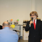 Greg Altieri, Strategic Development Manager, CDI, wearing a Donald Trump wig at the kick off opening.