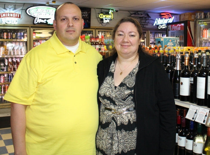 Owners Hector and Alicia Lopez of Dexter Warehouse Liquors.