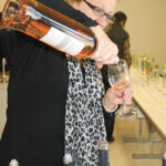 Martine Warner, Worldwide Wines Regional Manager, pouring a rosé.