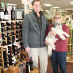 Jim Panzica, Store Manager and Doris Bowlby, Owner with Wine World's Shih Tzu, Buddy.